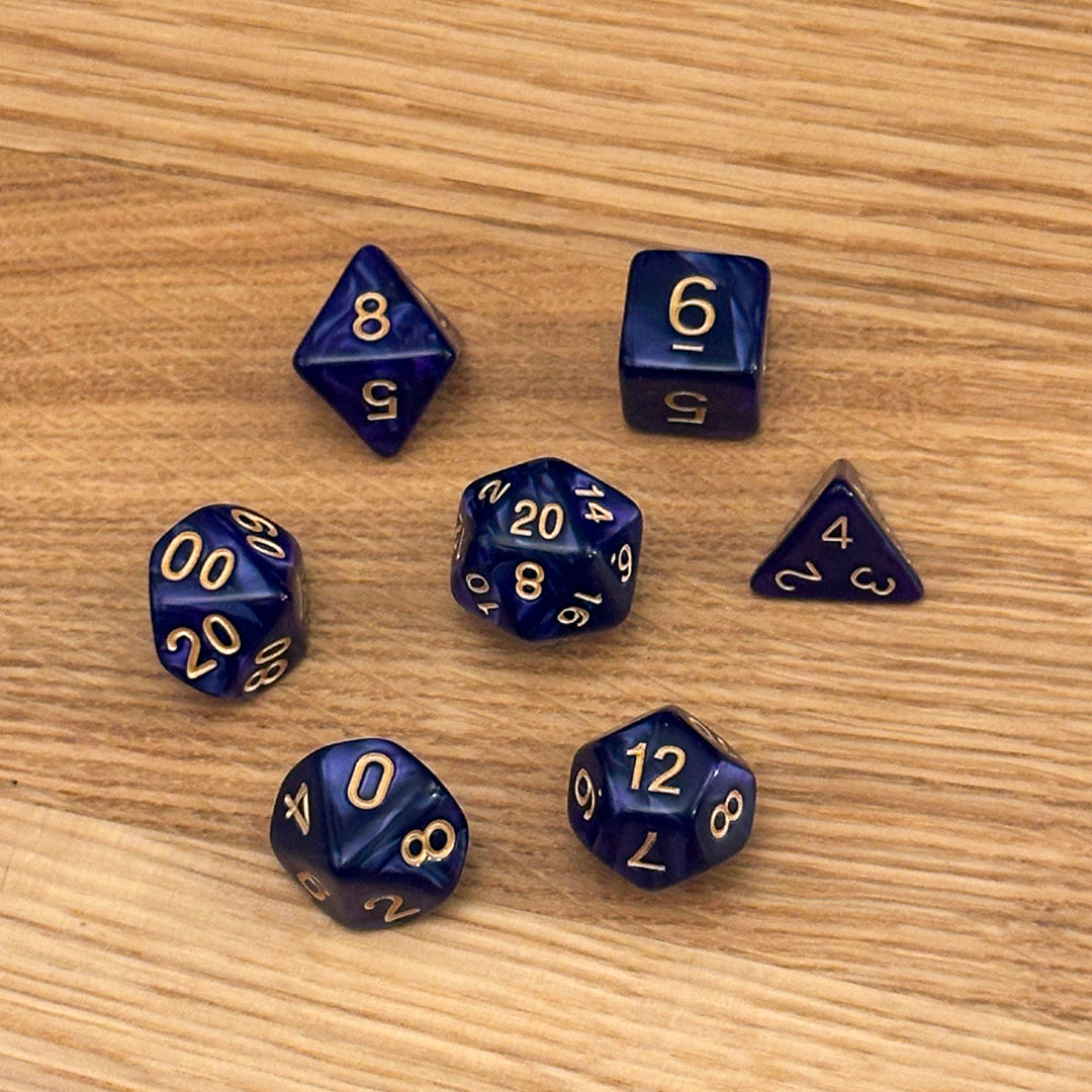 Set of 7 polyhedral dice (D4, D6, D8, D10, percentile D10, D12, D20) in swirled deep purple acrylic with gold number infill.
