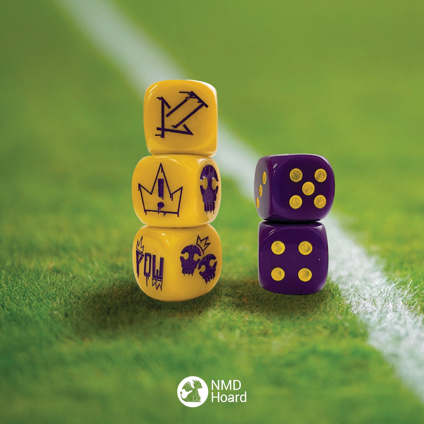 Yellow acrylic 16mm set of three block dice featuring graffiti street style action symbols for fantasy football with purple infill and two purple D6 dot dice with the NMD Hoard dragon logo on the 6 and yellow infill.