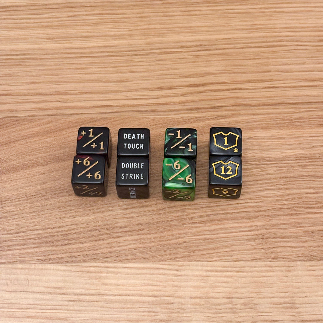 Set of six counter dice, including red +1/+1 counters, black text dice with keywords like 'Death Touch' and 'Double Strike', green -1/-1 counters, and black loyalty counters with yellow shield icons.